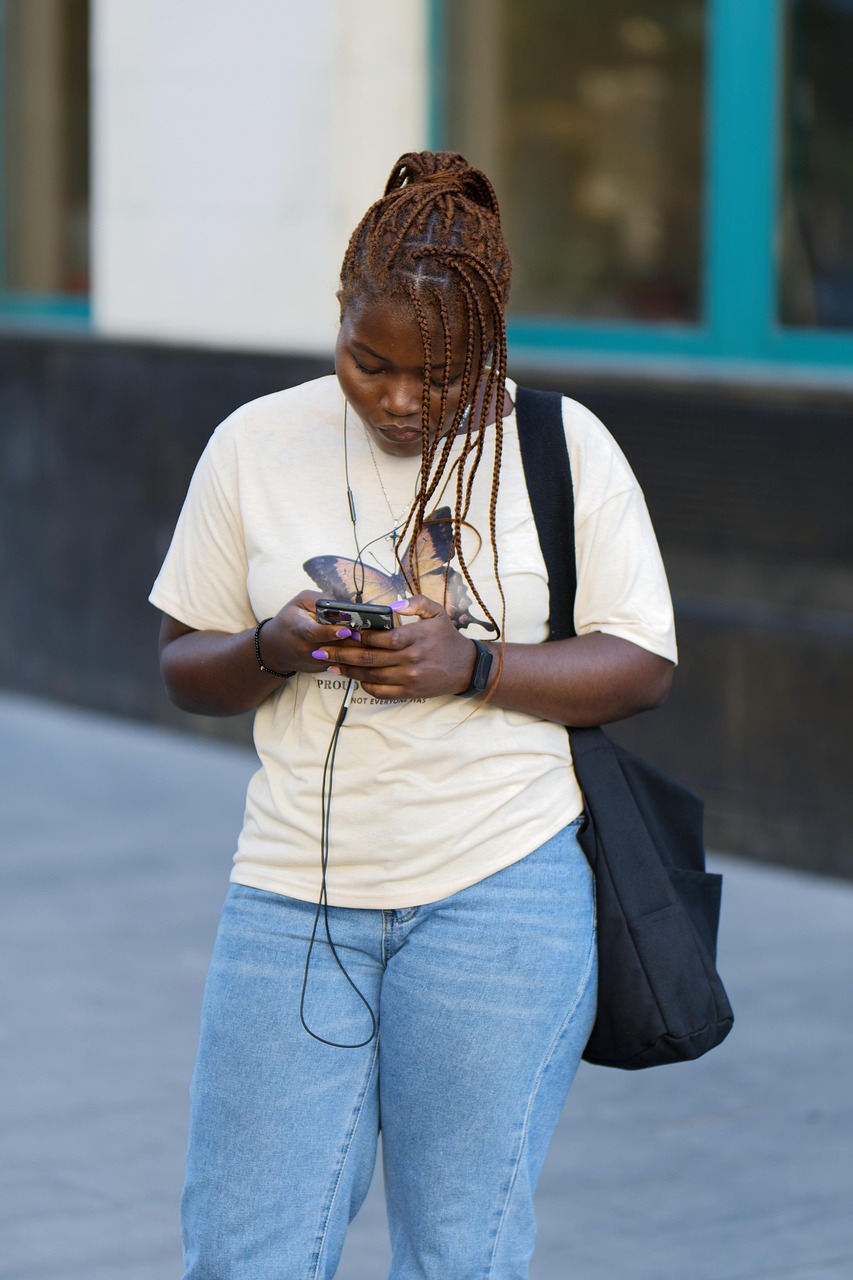 Woman checking her credit score on her phone with the BAFF app